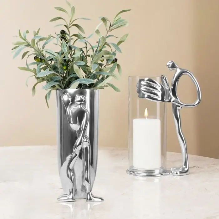 cb23_candleholderman_vaseleaningman.webp